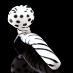 A studio shot of the Mr. Magnificent Sherlock pipe, featuring a white and black patterned design.