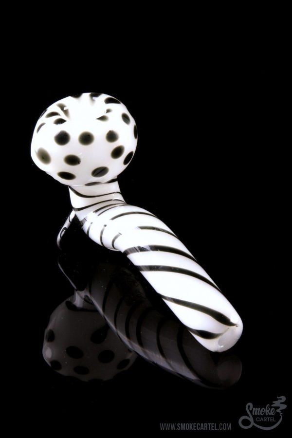 A studio shot of the Mr. Magnificent Sherlock pipe, featuring a white and black patterned design.
