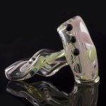 A close-up shot of the Green Slyme and Bubble Gum Inside-Out Pipe with Black Marbles, showing its swirling glass design and black marble accents.