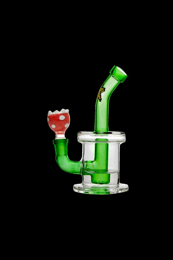 Green glass water pipe with a red and white mushroom-shaped mouthpiece.