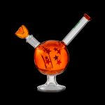 Orange glass bubbler with star detailing, isolated on a black background.