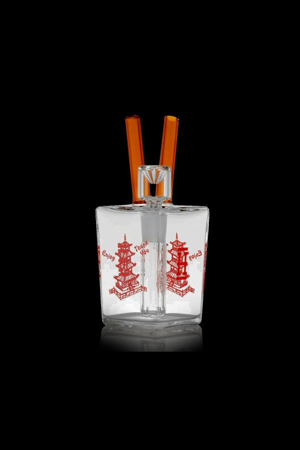 Clear glass bubbler water pipe with red pagoda design and orange mouthpiece.