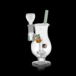 Clear glass bubbler water pipe with green accents and visible cannabis buds inside.