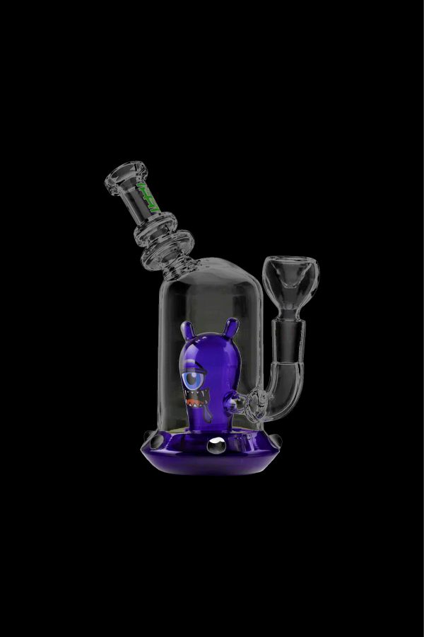 Purple glass water pipe with an alien-shaped perc inside, against a black background.