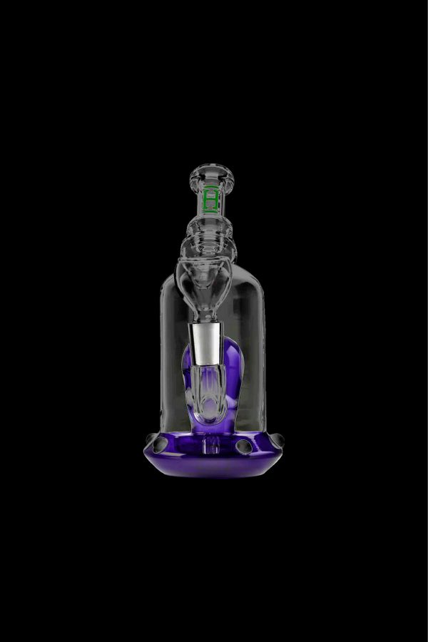 Glass dab rig with purple accents, isolated on a black background.