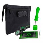 Black odor-proof bag with a combination lock, alongside a grinder, dab tool, and packaging for cannabis concentrates.