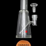 Glass bubbler water pipe with Canadian maple leaf detail and accompanying components, marketed as "Canada Puffin."
