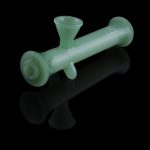 Green glass bubbler with a reflective surface.