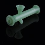 Frosted green glass bubbler with a reflective surface.