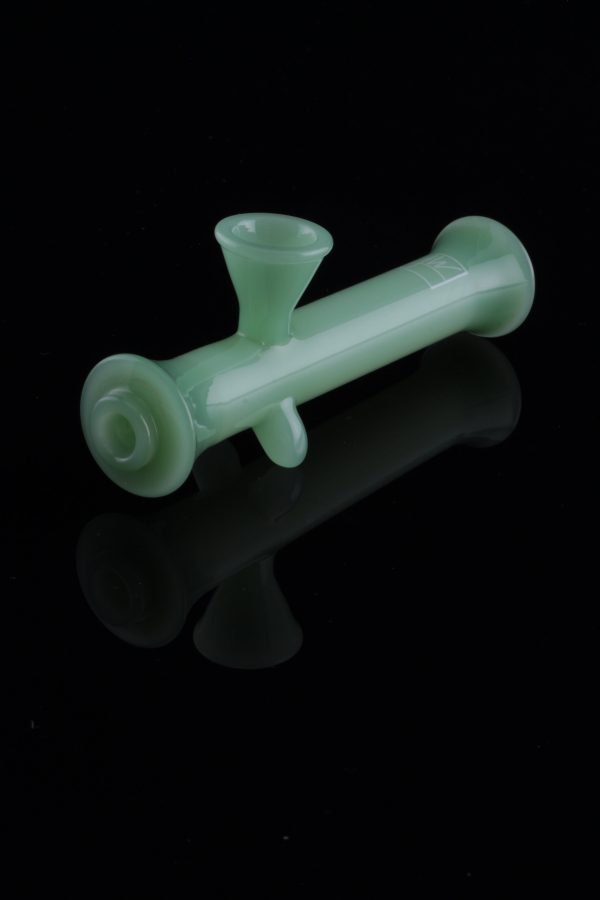 Frosted green glass bubbler with a reflective surface.