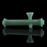 Green glass bubbler with reflection.