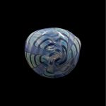 Blue and white swirled glass cannabis bowl against a black background.