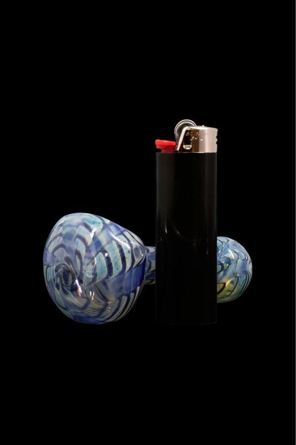 Glass cannabis pipe and lighter isolated on black.