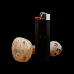 Glass cannabis pipe with a lighter.