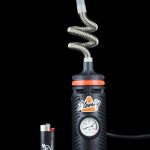 Close-up of the Storz & Bickel Plenty Vaporizer, showcasing the silver metallic body and its intricate hose connection.
