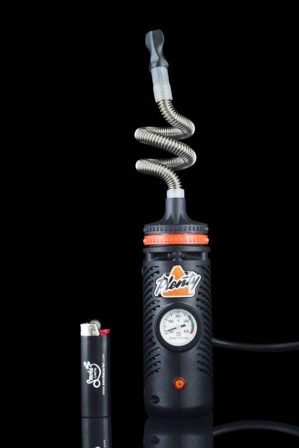 Close-up of the Storz & Bickel Plenty Vaporizer, showcasing the silver metallic body and its intricate hose connection.