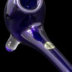Purple glass pipe with a speckled bowl and branded sticker.