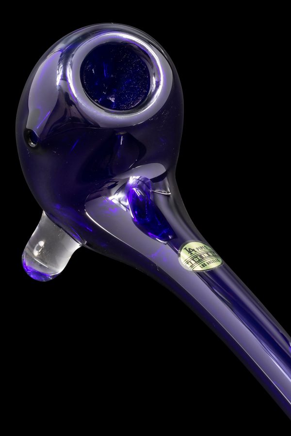 Purple glass pipe with a speckled bowl and branded sticker.