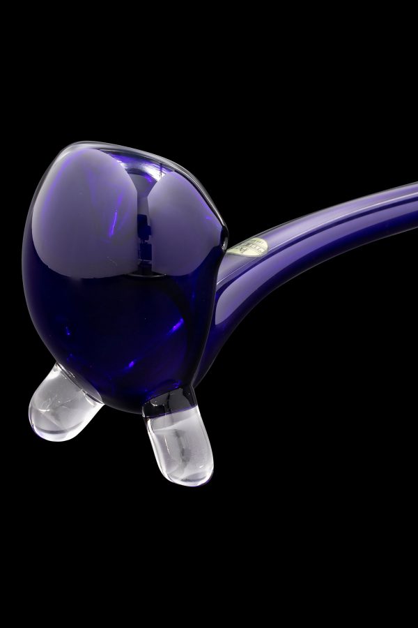 Purple glass pipe with clear footers against a black background.