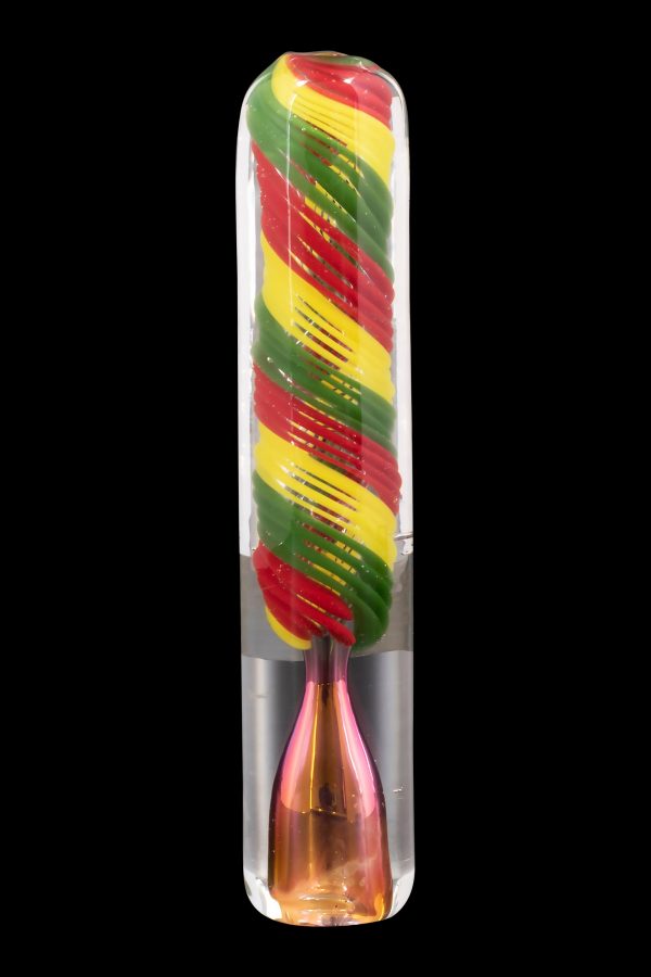Red, yellow, and green swirled glass cannabis oil burner pipe on a clear background.