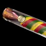 A colorful glass cannabis pipe with red, yellow, and green layers, labeled "A.R.I.Z.E. Made in USA Los Angeles."