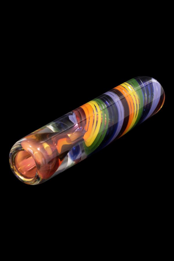 Hand-blown glass pipe with vibrant orange, green, and purple swirls, isolated on black.