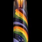 A colorful glass cannabis water pipe with swirling bands of purple, orange, green, and blue.