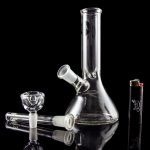 A studio shot of the LA Pipes Basic Beaker Water Pipe - Simply Guy, showcasing its clear glass construction in a downward-angled view.