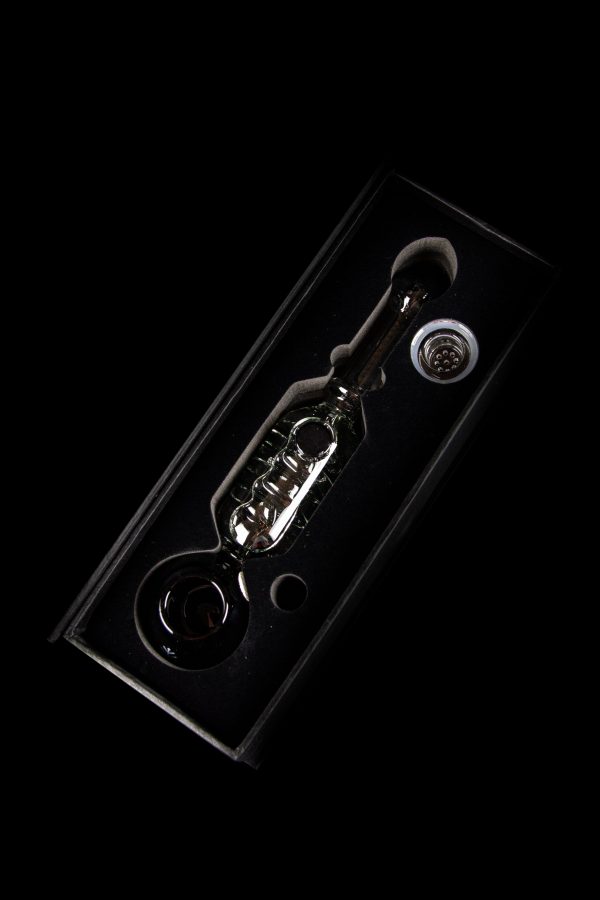 Glass oil rig with bubbler and dome, isolated on black.