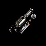 Clear glass cannabis water pipe with accessories on a black background.