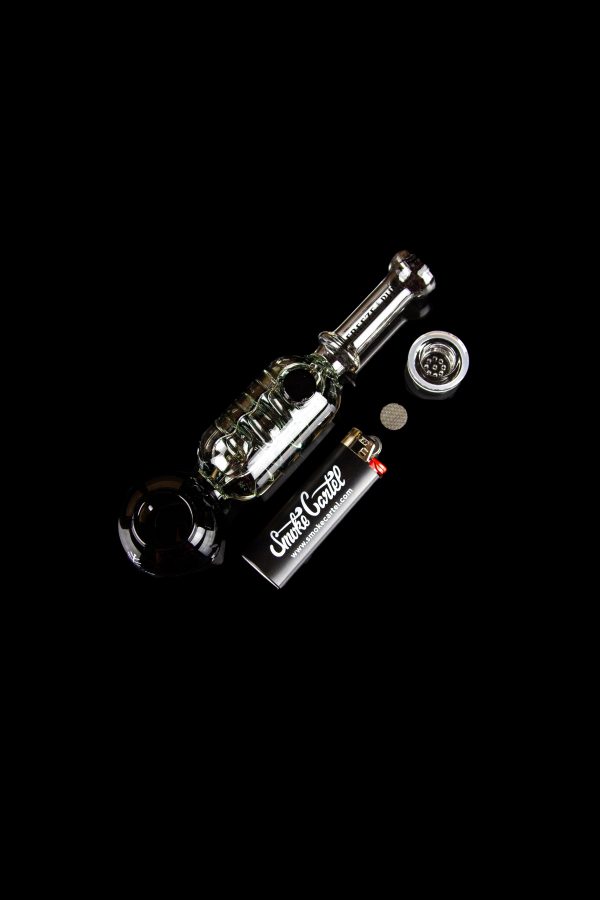 Clear glass cannabis water pipe with accessories on a black background.