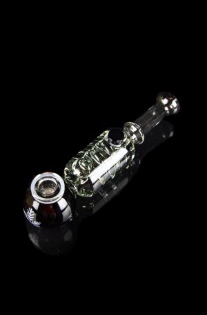 Glass cannabis pipe with intricate green and clear glasswork against a black background.