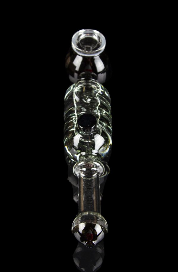 Glass bubbler with green accents and red mouthpiece, isolated on black.