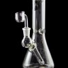 Clear glass water pipe (bong) with a quartz banger, studio shot on a black reflective surface.