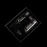 Clear glass dab rig components displayed in a plastic insert.