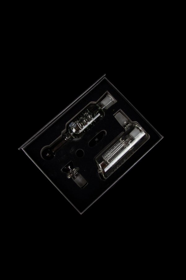 Clear glass dab rig components displayed in a plastic insert.