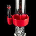 Red silicone attachment for a glass water pipe with a cannabis concentrate dab rig insert.