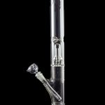 Clear glass bong with ice catcher and detachable downstem against a black background.