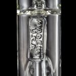 Close-up of a clear glass bong with etched branding.