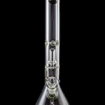 Clear glass bong with ice catcher and flared base, studio shot on a black reflective surface.