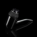 Sleek, black cannabis water pipe with a transparent glass chamber and angled mouthpiece, isolated on a dark background.