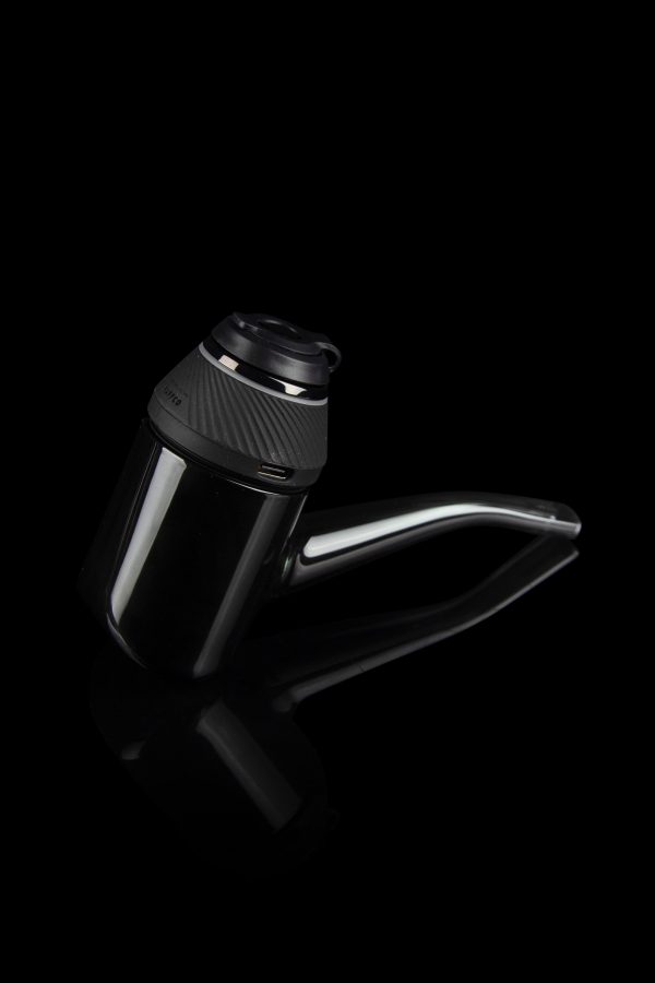 Sleek, black cannabis water pipe with a transparent glass chamber and angled mouthpiece, isolated on a dark background.