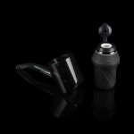 Puffco Peak Pro portable dab rig with accessories on a reflective surface.