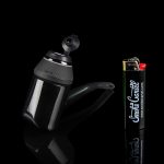 Black cannabis oil press and lighter with “Smoke Cartel” branding against a dark background.