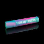 A colorful, cylindrical smoking kit with the text "HUMAN SUCKS" printed on its side, reflected on a black surface.
