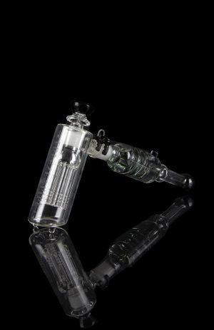 Clear glass water pipe (rig) with intricate percolators against a black background.