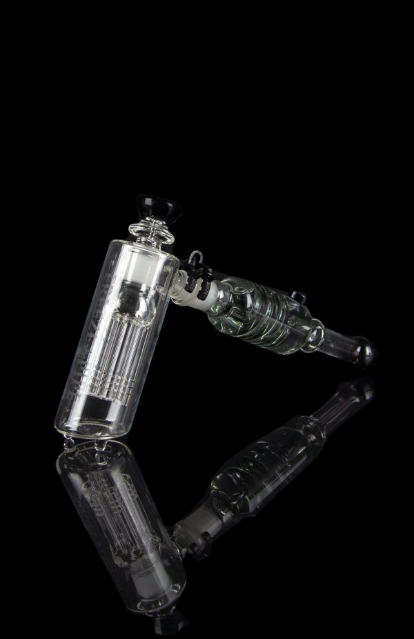 Clear glass water pipe (rig) with intricate percolators against a black background.