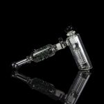 Clear glass rig with percolators against a black background.