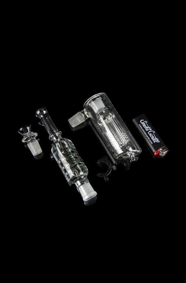 Two glass bubblers with intricate percolators, isolated on a black background.