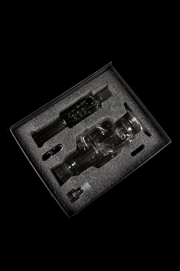 Glass cannabis water pipe and accessories neatly arranged in a black foam insert within a presentation box.